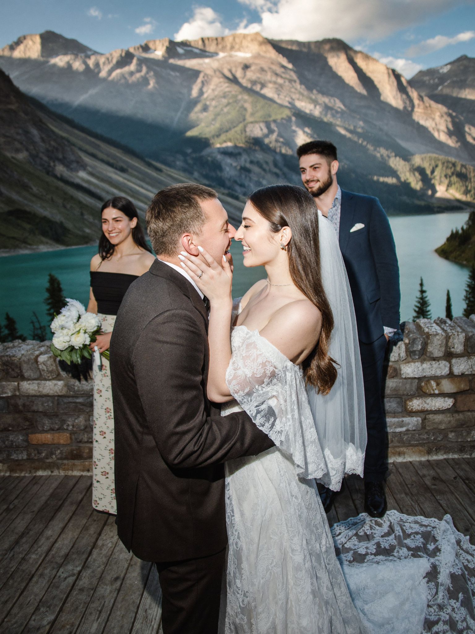 A couple on a quiet rock bench above the Bow Valley in Banff