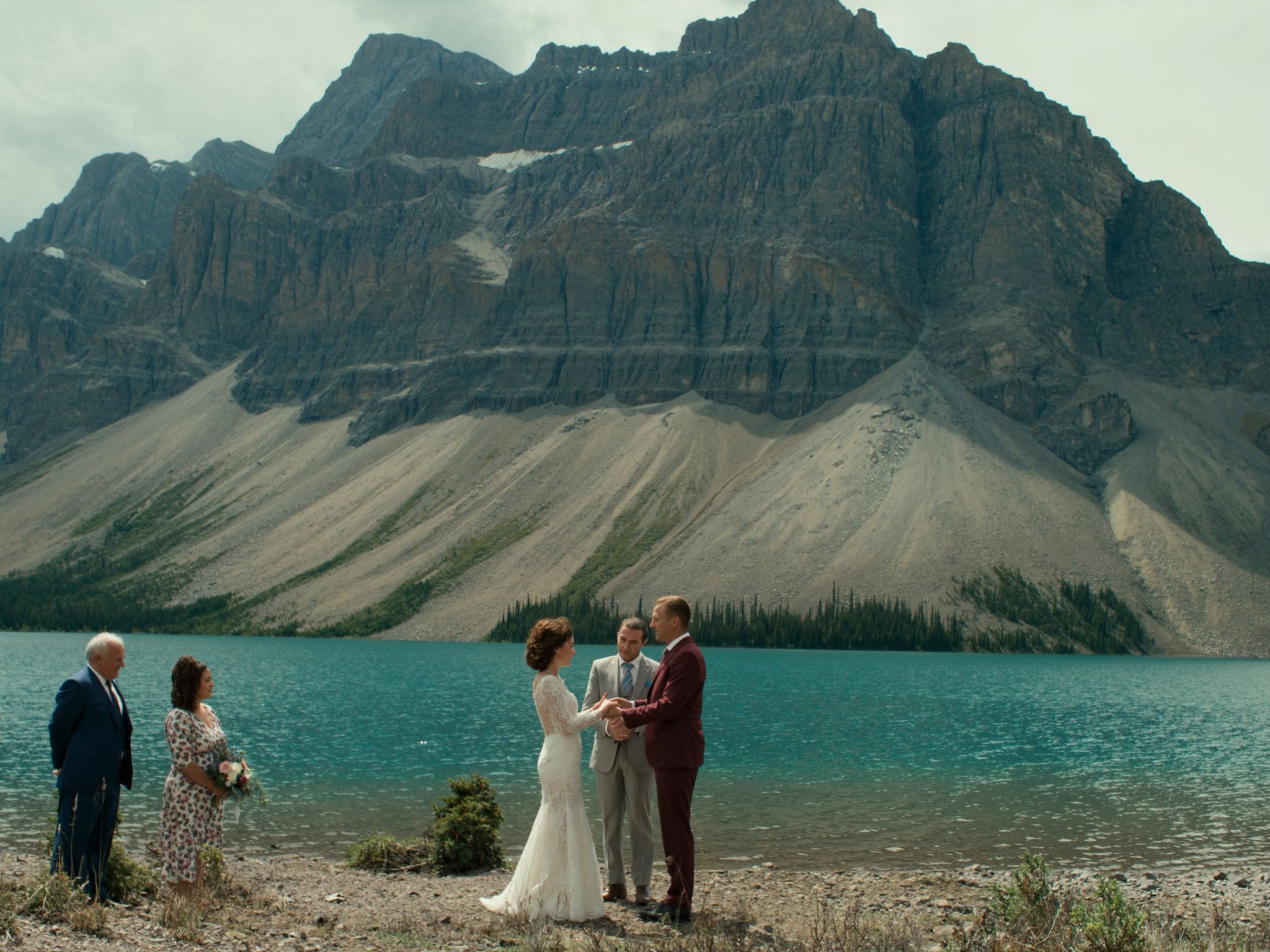 A small ceremony on the shore of a turquoise lake in Banff National Park