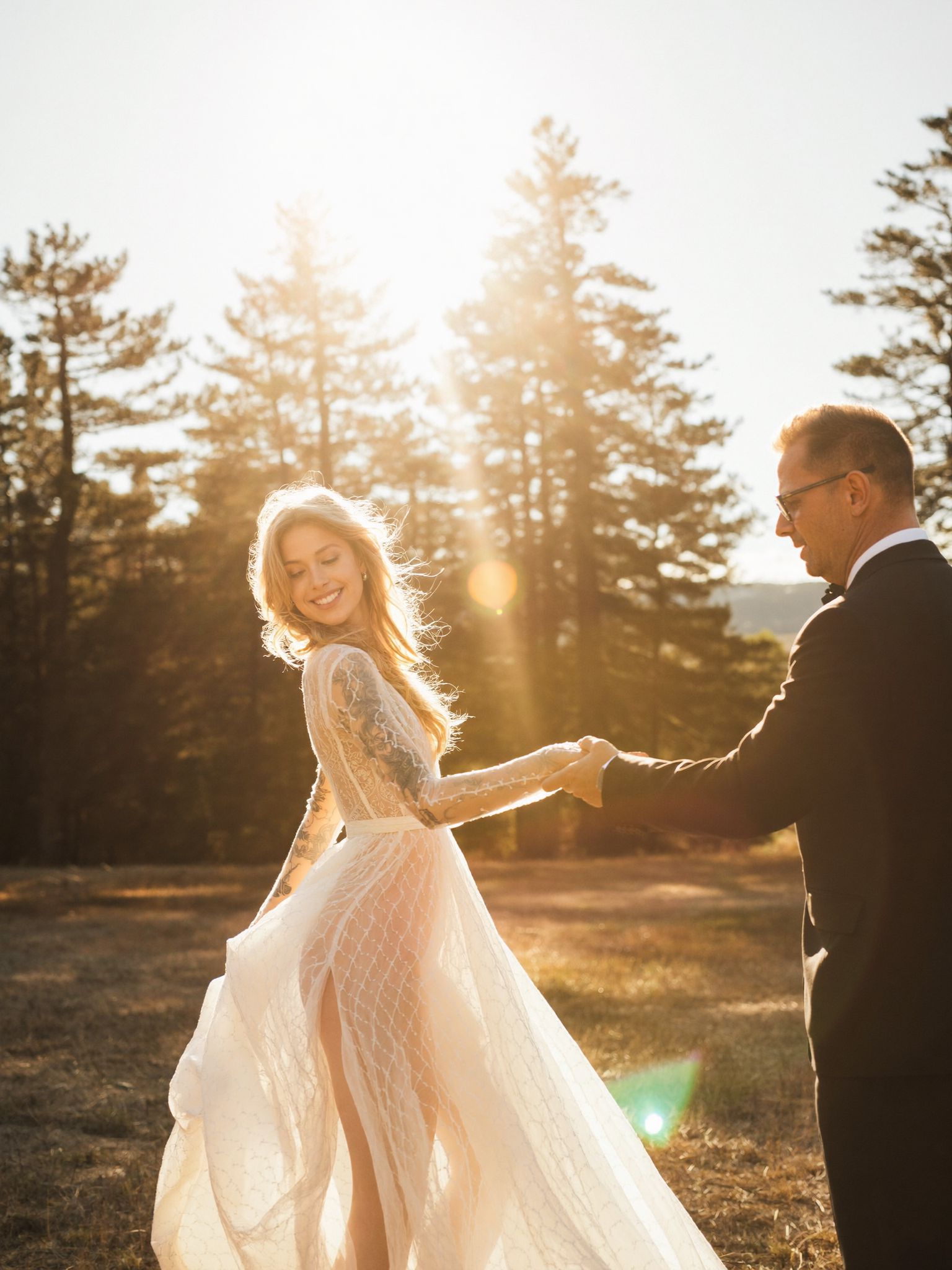 A couple signing their marriage licence outdoors in the Rockies