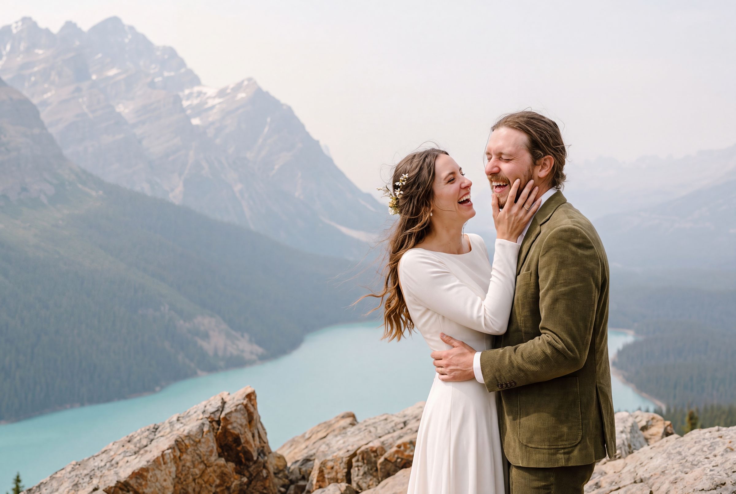 An elopement photographed by Arman Arai above a mountain lake