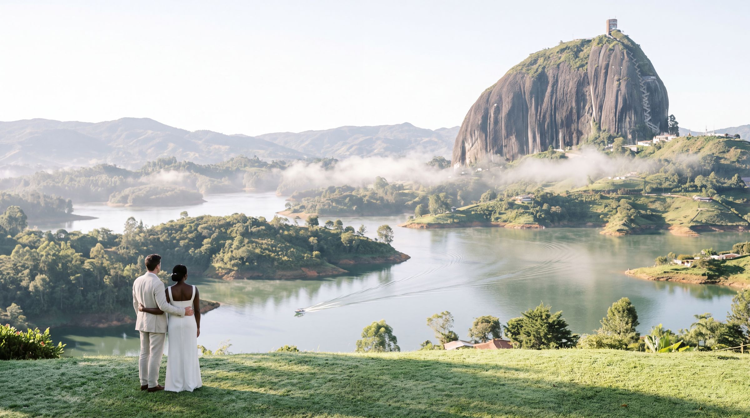 A couple above the green water labyrinth at Guatapé with the monolith behind