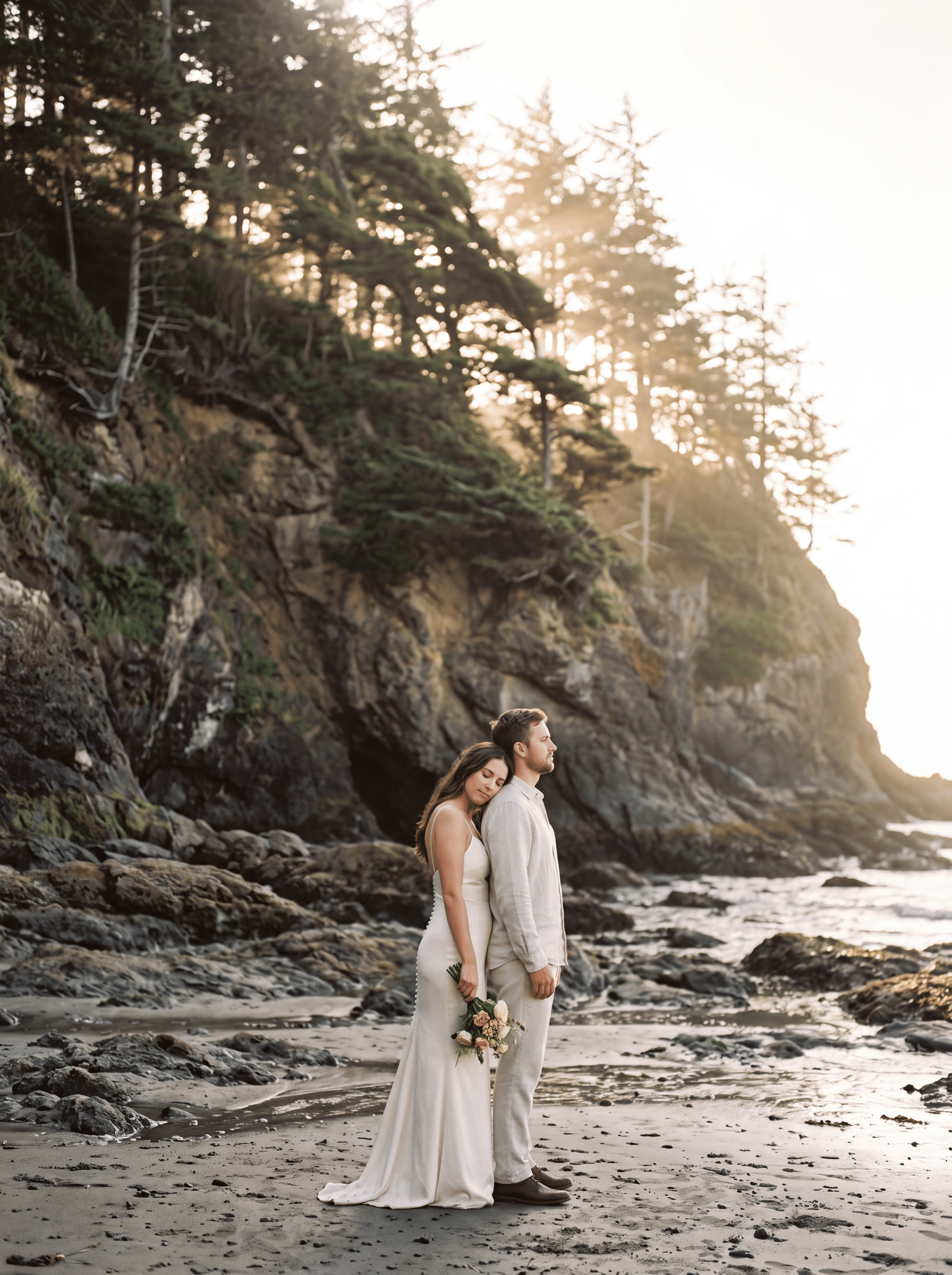 A couple beneath the trees on Vancouver Island