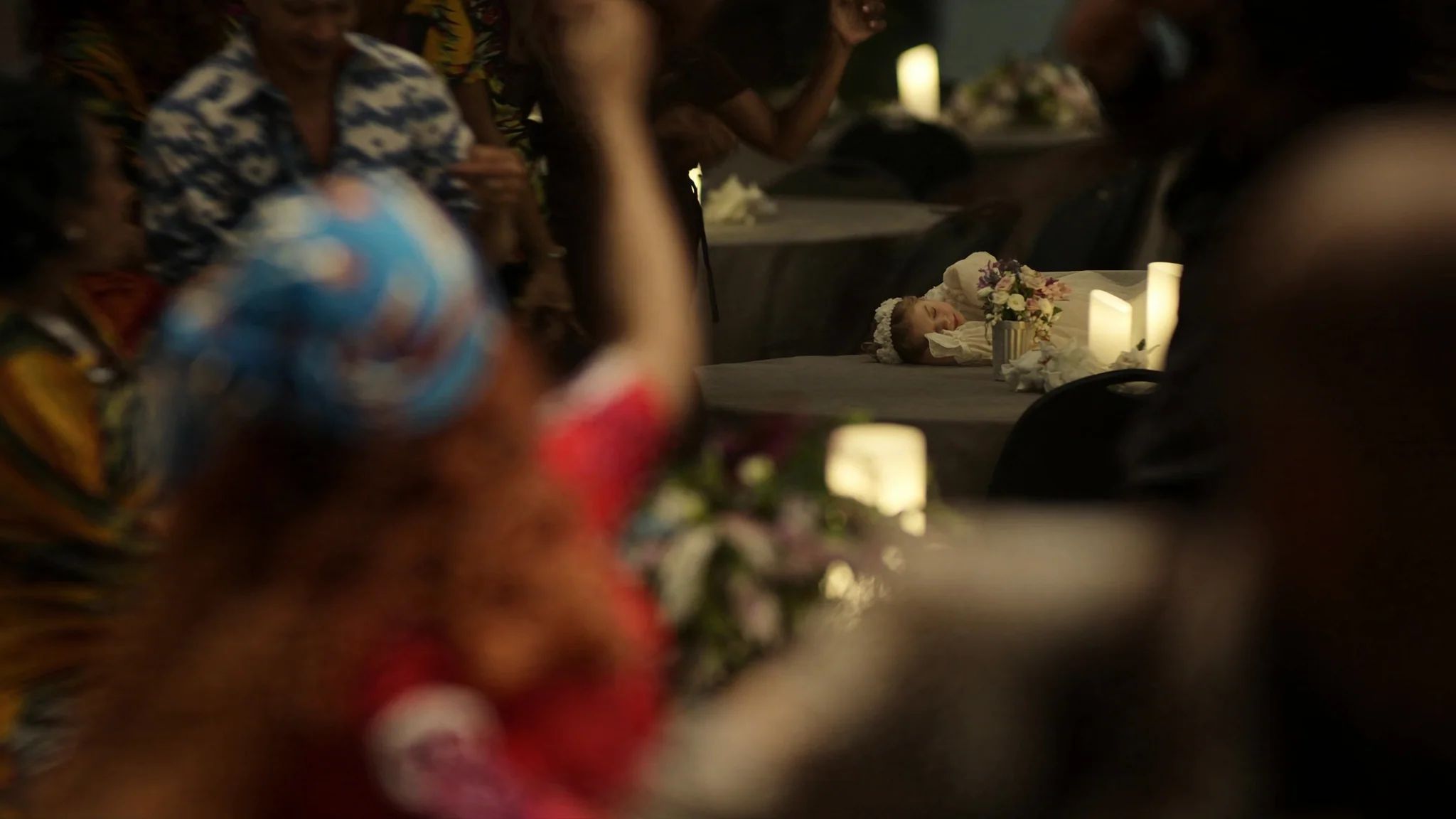 A guest raising a glass mid-toast at a Toronto reception