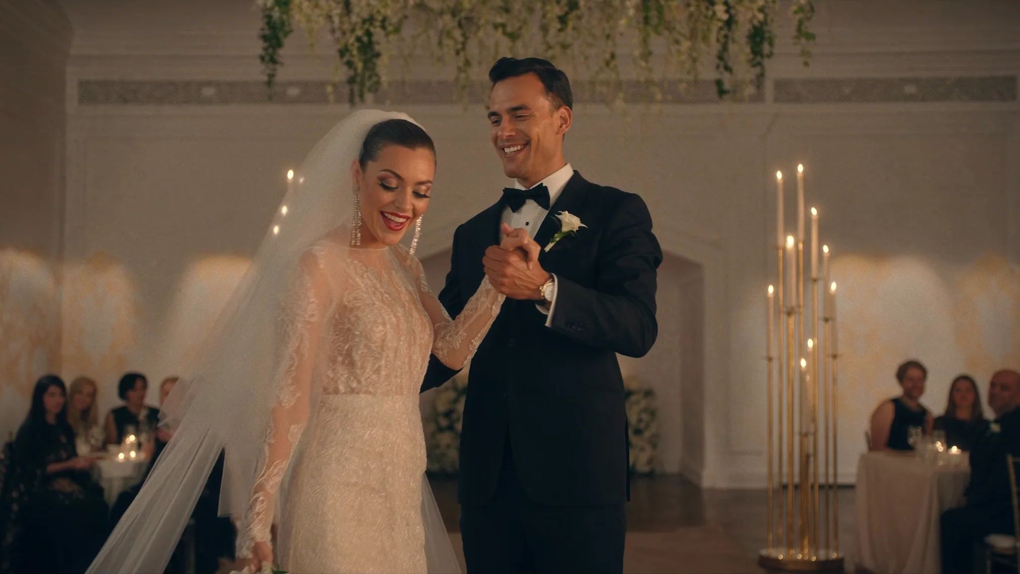Ceremony lit by a row of tall taper candles
