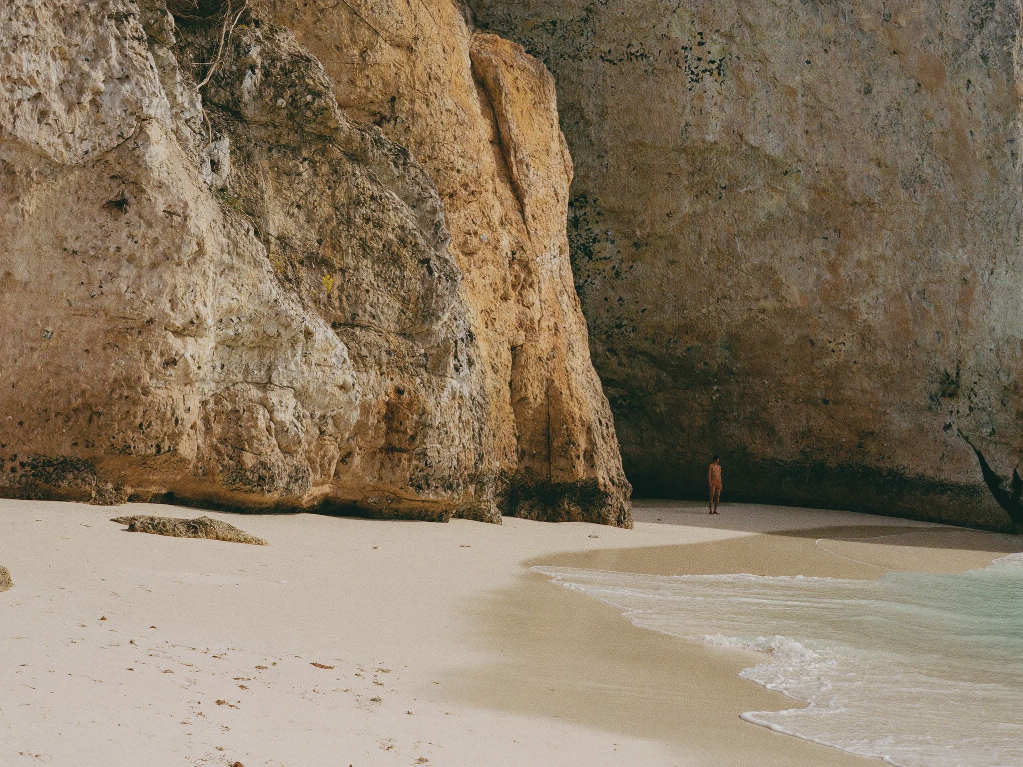 White rock cliffs above an empty beach