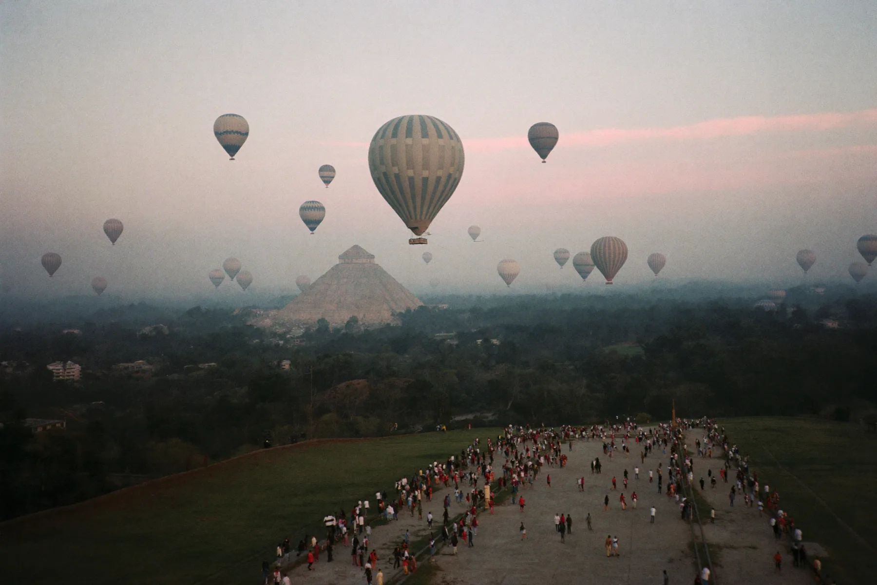 Hot air balloons over the pyramids at Teotihuacan at sunrise