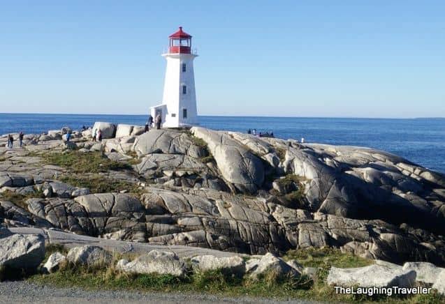 Peggy&rsquo;s Cove lighthouse and the cliffs of Cape Split in Nova Scotia