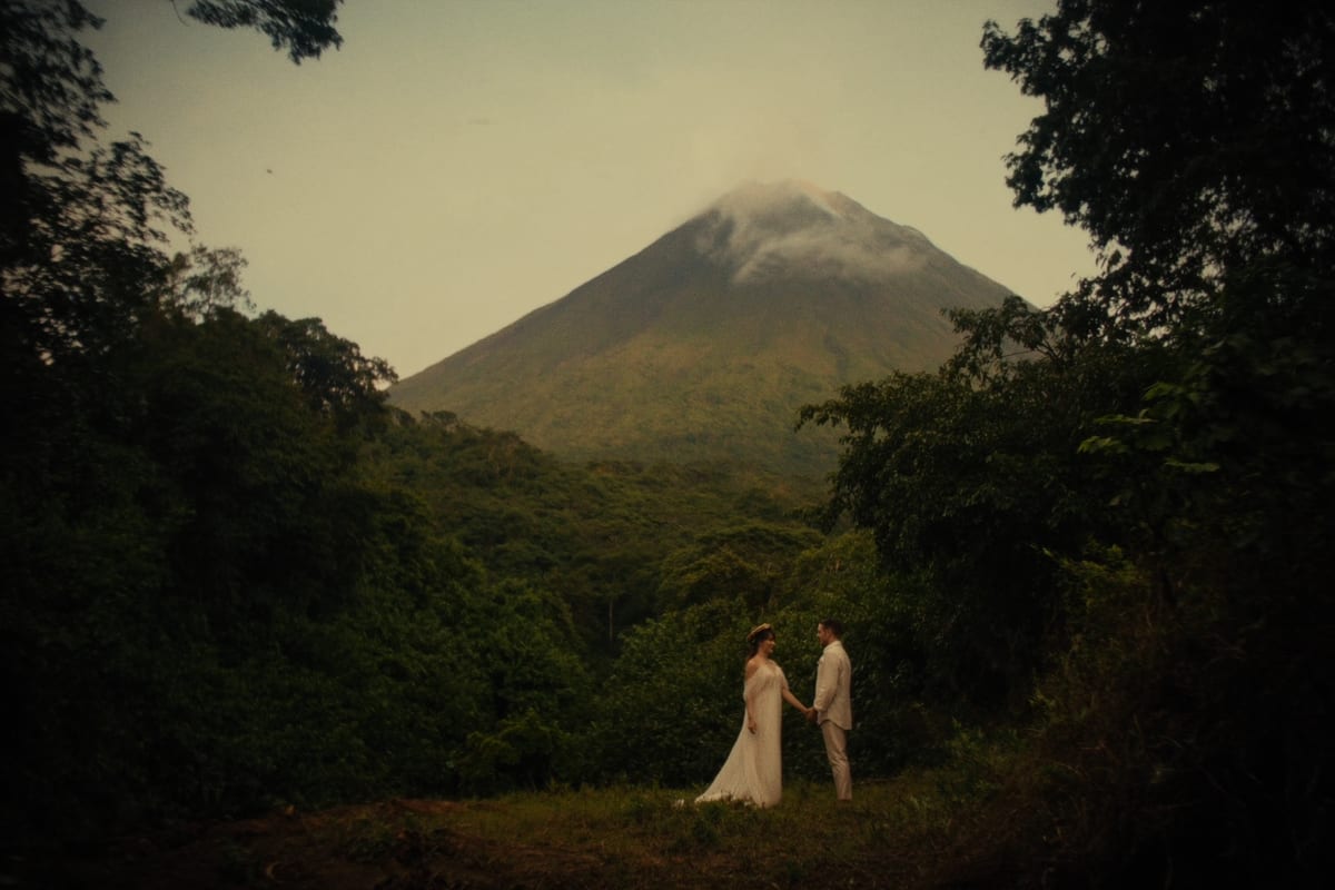 The Arenal volcano cone rising above the rainforest
