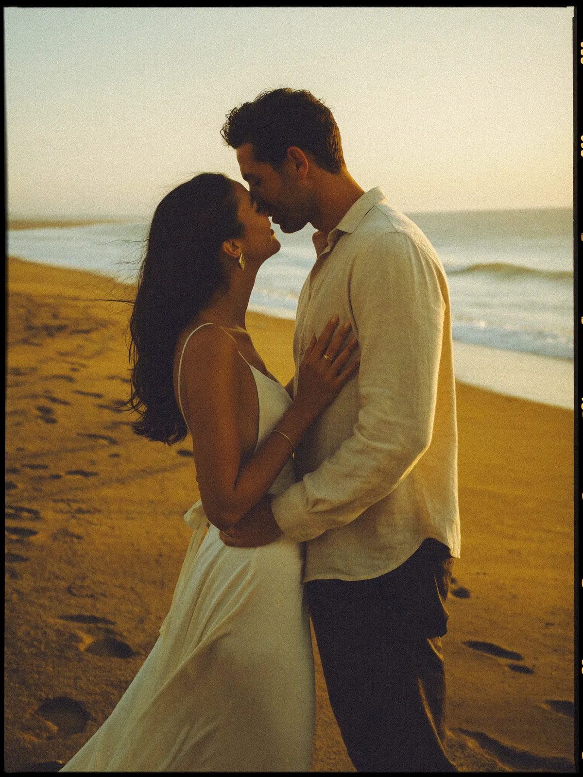 A bride and groom on the Mexican coast at golden hour